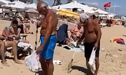 PLAJDA YAN GELİP YATMAK YERİNE TEMİZLİK NÖBETİ